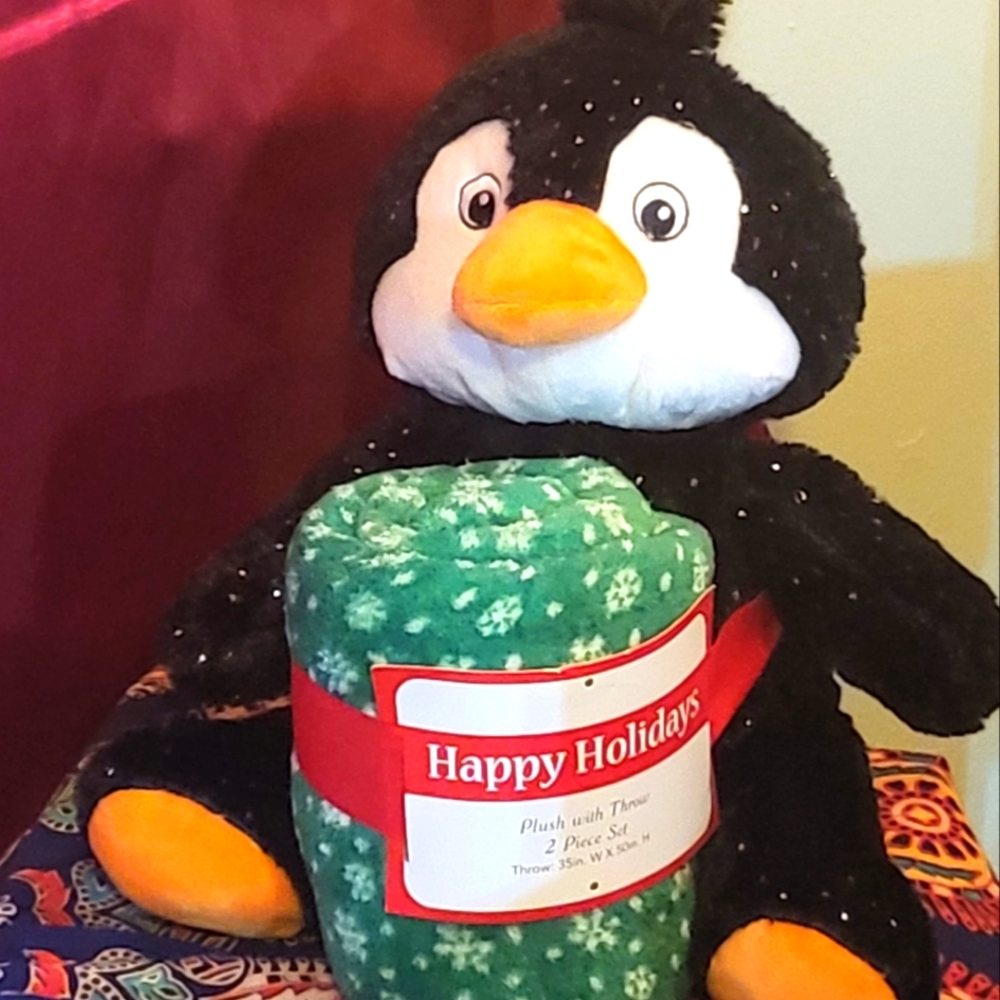 Plush holiday penguin with throw